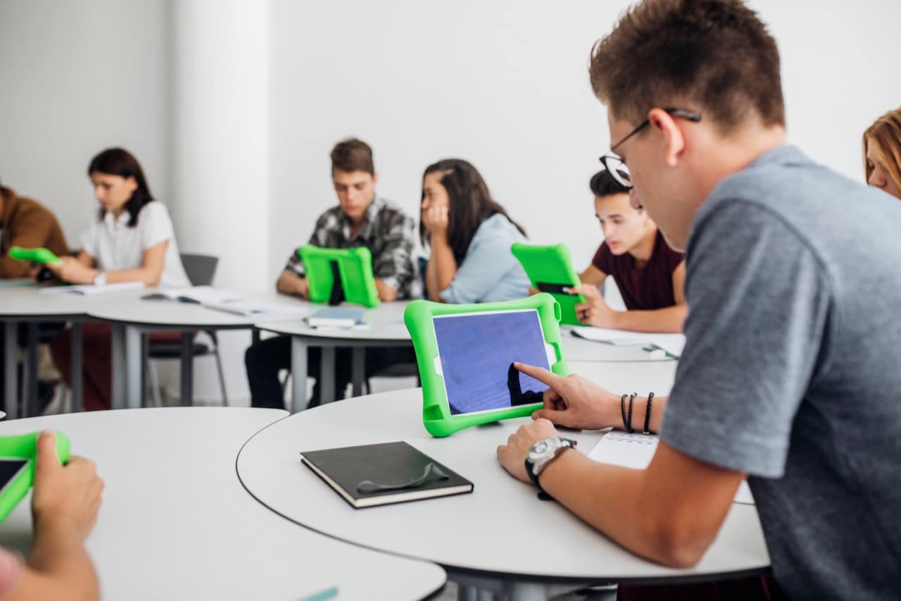 A group of students using digital display